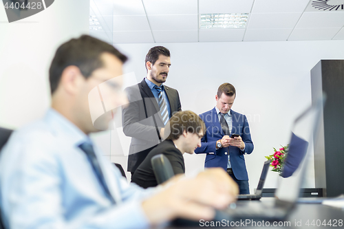 Image of Business people in modern corporate office.