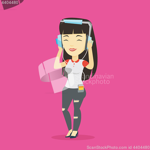 Image of Young woman in headphones listening to music.