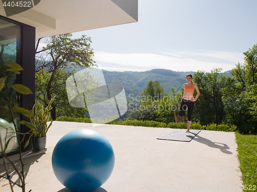 Image of woman doing morning yoga exercises