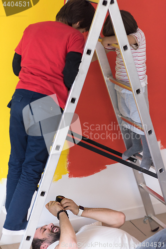 Image of boys painting wall