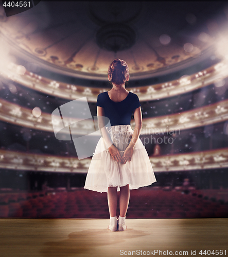 Image of Baby girl dreaming a dancing ballet on the stage. Childhood concept.