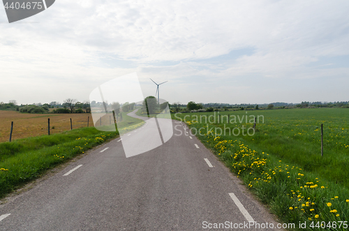 Image of Country road by a wind turbine