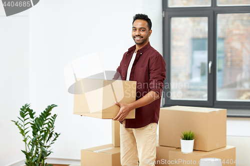 Image of happy man with box moving to new home