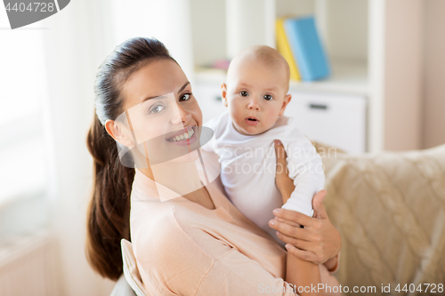 Image of happy mother with little baby boy at home