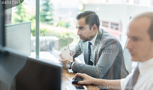 Image of Business team analyzing data at business meeting.