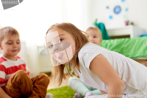 Image of girl showing tongue at home