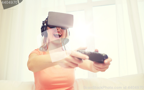 Image of woman in virtual reality headset with controller