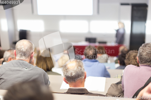 Image of Business speaker giving a talk at business conference event.