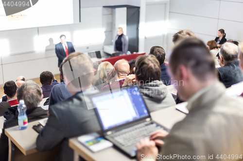 Image of Business speaker giving a talk at business conference event.