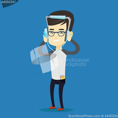 Image of Young man in headphones listening to music.