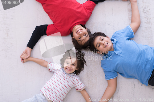 Image of young boys having fun on the floor