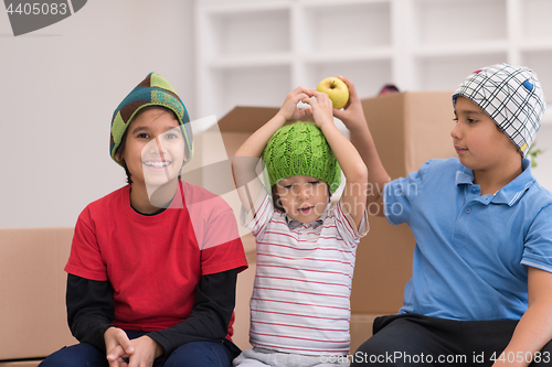 Image of boys with cardboard boxes around them