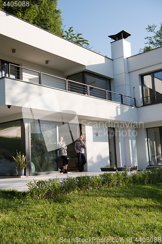 Image of couple enjoying on the door of their luxury home villa