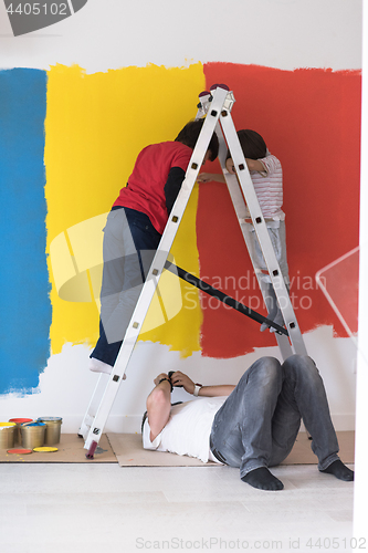 Image of boys painting wall