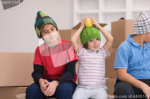 Image of boys with cardboard boxes around them