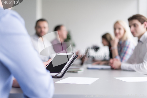 Image of Businessman using tablet in modern office