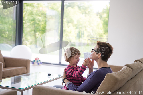 Image of mother and cute little girl enjoying their free time