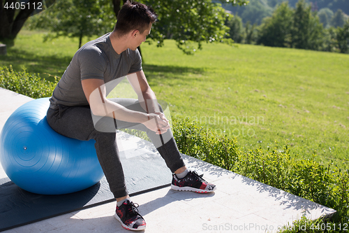 Image of man doing morning yoga exercises