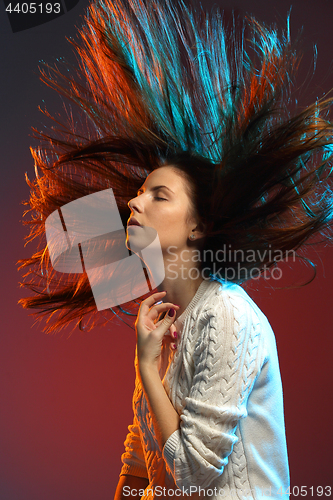 Image of Trendy hairstyle concept. Young woman with colorful dyed hair on color background