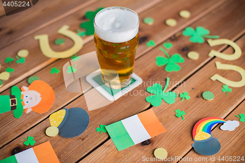 Image of glass of beer and st patricks day decorations