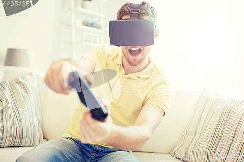 Image of man in virtual reality headset with controller