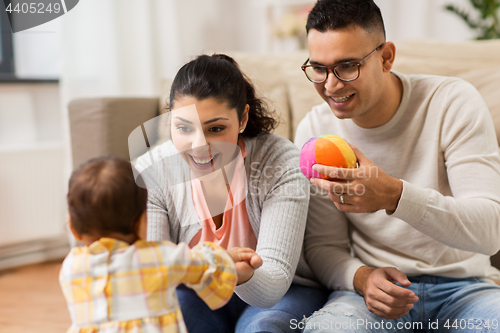 Image of happy family and baby daugter playing at home