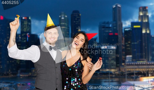 Image of happy couple party in night singapore city