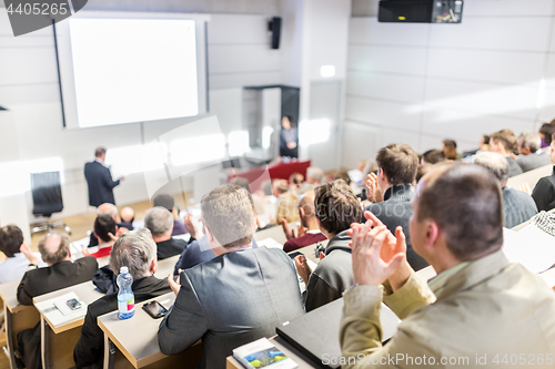 Image of Business speaker giving a talk at business conference event.