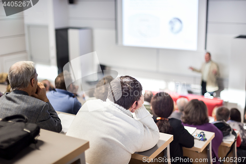 Image of Business speaker giving a talk at business conference event.