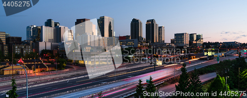 Image of Early Morning Commuters Create Light Trails Before Rush Hour in 