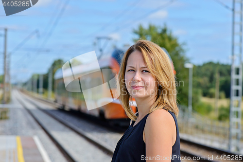 Image of Female waiting train on the platform