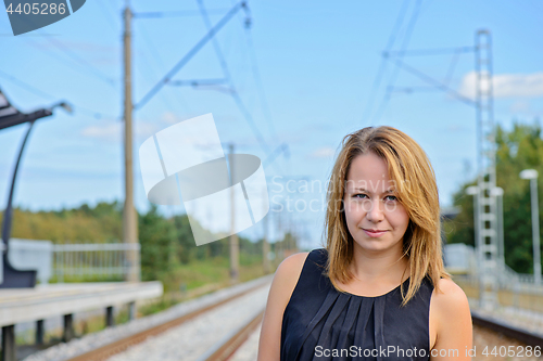 Image of Portrait of girl near railway path