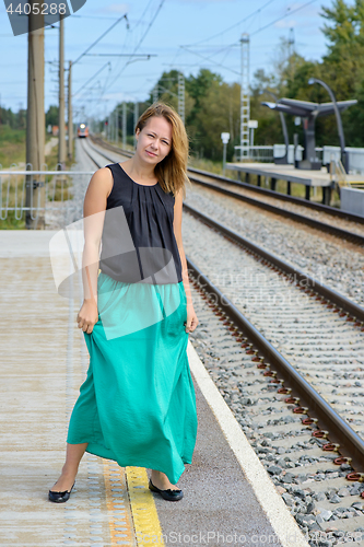 Image of Walking girl on platform