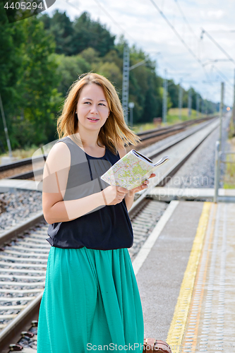 Image of Female waiting train on the platform