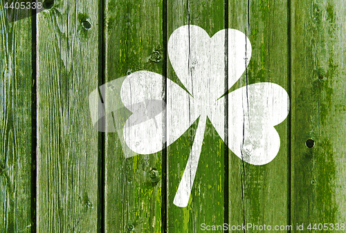 Image of shamrock silhouette on old green wooden boards