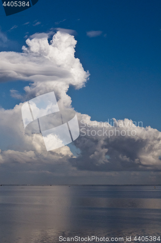 Image of White clouds and blue ocean. 