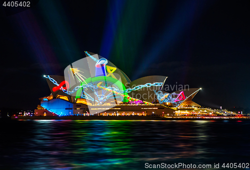 Image of Sydney Opera House illuminated with vibrant moving graphics
