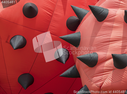 Image of Detail of red stationary kites