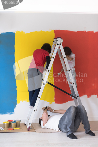 Image of boys painting wall