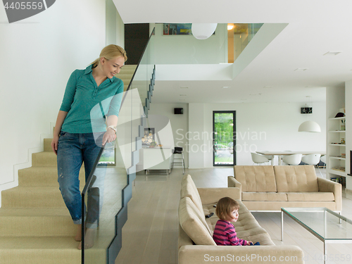 Image of portrait of a young beautiful woman on the stairs