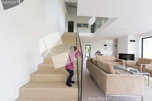 Image of family with little girl enjoys in the modern living room