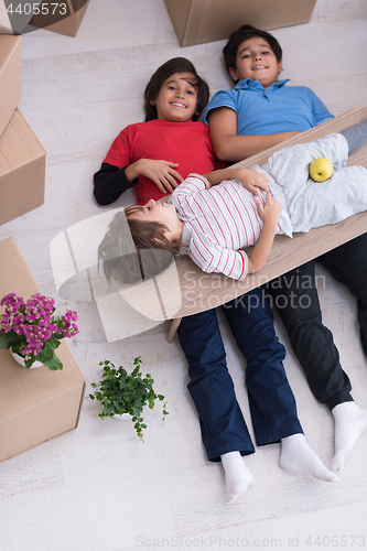 Image of boys with cardboard boxes around them top view