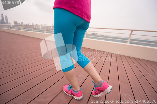 Image of woman running on the promenade