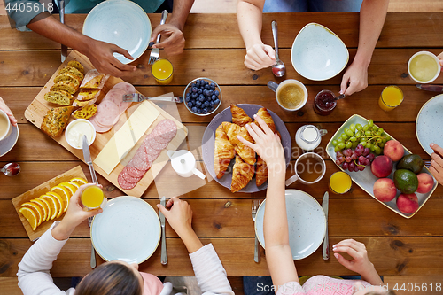 Image of group of people having breakfast at table