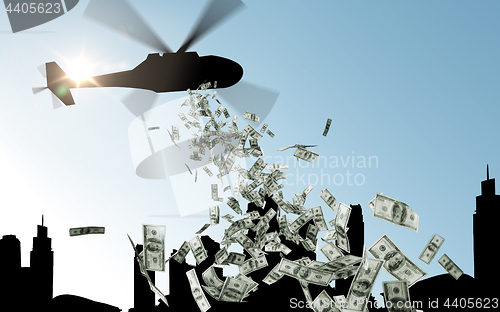 Image of helicopter in sky dropping money over city