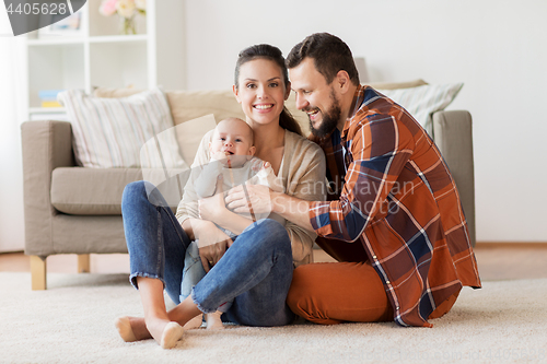 Image of happy family with baby at home