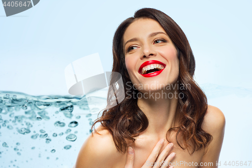 Image of beautiful laughing young woman with red lipstick