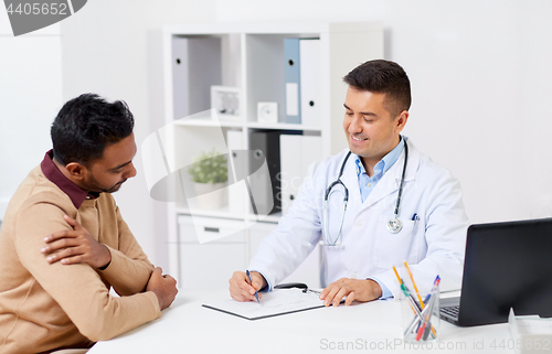 Image of happy doctor and male patient meeting at hospital