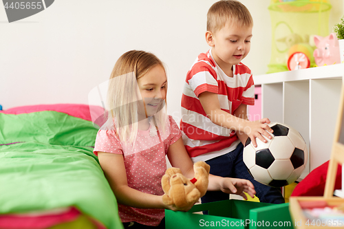 Image of happy kids with toys at home