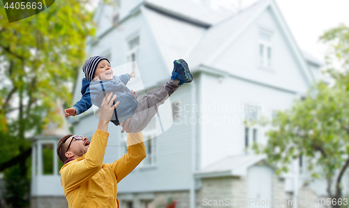 Image of father with son playing and having fun outdoors